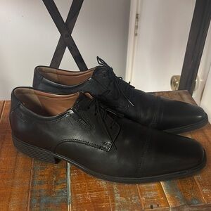 Clarks Black Slip-On Loafers with Polished Finish